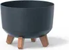 A dark gray planter pot with three wooden legs, shown against a white background. Anteprima dell’immagine prodotto