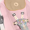 A close-up of a pink baby bouncer seat with safety straps and numbered indicators. Produktbild-Vorschau