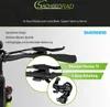 Close-up view of bicycle handlebars and derailleur with marketing text and logos. Produktbild-Vorschau