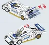 Instructional diagrams showing how to open the doors and rear engine cover of a white and blue Mazda 787B model car. Voir les images du produit