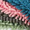 A close-up, macro view of a multi-colored microfiber chenille mop head, showing the texture and individual strands. Produktbild-Vorschau