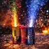 Three fireworks canisters are set off on the ground, creating colorful sparks and smoke. Náhled obrázku produktu