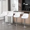 Four white bar stools are arranged in a modern kitchen setting. Produktbild-Vorschau
