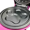 Close-up of an open pink waffle maker with a paw print-shaped mold. Náhled obrázku produktu