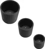 Three black cylindrical planters of varying sizes are arranged diagonally on a white background. Produktbild-Vorschau