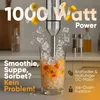 A hand blender is shown in action, blending ice and fruit in a glass, with text highlighting its features. Produktbild-Vorschau
