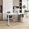 A modern office setup with a white adjustable desk, computer monitor, and office chair. Náhled obrázku produktu