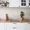 A kitchen counter with a backsplash and cabinets. Produktbild-Vorschau