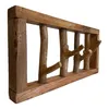 A wooden coat rack with branch-like hooks. Produktbild-Vorschau