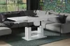 A modern living room with a sectional sofa and a white high-gloss lift-top coffee table. Voir les images du produit