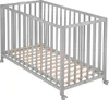 A gray foldable baby crib with a wooden slatted base, shown from a diagonal angle on a white background. Produktbild-Vorschau