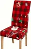 A Christmas-themed chair cover on a chair. Náhled obrázku produktu