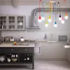 A modern kitchen with a multi-colored pendant light fixture hanging over an island. Anteprima dell’immagine prodotto