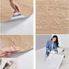 A collage of images showing a wood-look vinyl floor sticker, its waterproof properties, and a person unrolling it. Anteprima dell’immagine prodotto