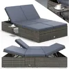 A gray wicker double sun lounger with blue cushions and a small side table with a cup of coffee. Produktbild-Vorschau