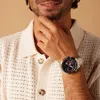 A man wearing a watch and a knitted shirt. Náhled obrázku produktu