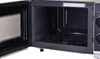 An open microwave oven with the interior visible. Voir les images du produit