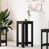 A modern living room scene with a black bar table, a plant, and shelves on the wall. Produktbild-Vorschau