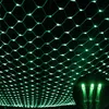 A close-up view of a green LED net light string against a dark background, with a small inset showing three individual lights. Voir les images du produit