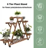 A wooden plant stand with multiple tiers, holding several potted plants. The stand is shown with decorative icons and text on the right side, highlighting its features. Produktbild-Vorschau