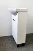 A white bathroom cabinet with a sink on top, standing on black legs on a grey carpet. Podgląd zdjęcia produktu