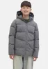 A young boy wearing a puffer jacket and a sweater. Produktbild-Vorschau