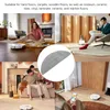 Collage of lifestyle images showing a robot vacuum cleaner in different home settings, with a close-up of a microfiber mop pad. Voir les images du produit
