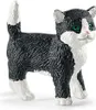 A figurine of a black and white cat. Anteprima dell’immagine prodotto