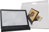 A black smartphone screen magnifier with a white box in the background showing a cheetah image. Náhled obrázku produktu