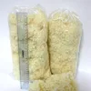 Two bags of fluffy material, possibly wool, with a ruler next to one bag for scale. Produktbild-Vorschau