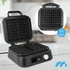 A black electric waffle maker is shown open, with a close-up inset of its waffle plates. The waffle maker has a digital display showing '3:08' and a dial for settings. It sits on a countertop. Náhľad obrázku produktu