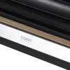 A close-up view of a section of a black appliance with a silver band and a wood-grain accent. Anteprima dell’immagine prodotto