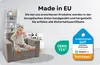 A baby sits on a small armchair in a room with shelves and toys. Produktbild-Vorschau