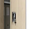 A close-up view of a filing cabinet lock and key, with a file folder visible inside the cabinet. Voir les images du produit