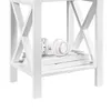 Close up of a white side table with a pair of white headphones and books on the shelf. Podgląd zdjęcia produktu