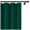 A dark green curtain hanging from a black curtain rod. Podgląd zdjęcia produktu