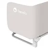 A close-up view of a beige bed rail with the brand logo visible. Voir les images du produit
