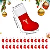 A red Christmas stocking with a white trim and the letter 'Y' embroidered in gold, shown with measurement lines and text indicating its dimensions. Below the stocking are rows of smaller Christmas stockings, each with a letter of the alphabet. Podgląd zdjęcia produktu