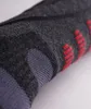 A close-up view of a dark gray sock with red and purple accents. Produktbild-Vorschau