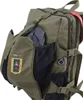 Close-up of a green backpack with a patch and mesh pocket. Produktbild-Vorschau