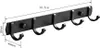 A black coat rack mounted on a wall. Voir les images du produit