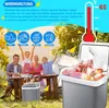 A family is having a picnic outdoors with a cooler box. Produktbild-Vorschau
