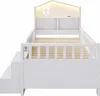 A white children's bed with stairs and a house-shaped headboard with LED lighting. Anteprima dell’immagine prodotto