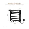 A diagram showing the dimensions of a black electric towel warmer with text overlays indicating installation instructions and measurements. Anteprima dell’immagine prodotto