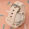 A close-up shot of a pink Casio Baby-G watch strap and buckle, set against a pink and white striped background. Podgląd zdjęcia produktu