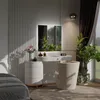 A well-lit bedroom scene featuring a vanity with a mirror and stool, alongside a dresser and a large potted plant. Produktbild-Vorschau