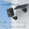 A solar-powered security camera with a solar panel mounted on a wall. Náhled obrázku produktu