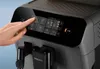 A hand is shown interacting with the touchscreen display of a Philips coffee machine. Produktbild-Vorschau
