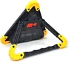The back of a black and yellow triangular LED warning light with its legs extended. Voir les images du produit