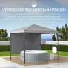 An inflatable hot tub is set up on a wooden deck under a gray gazebo, with a lush green lawn and a distant view of the sea. Náhled obrázku produktu